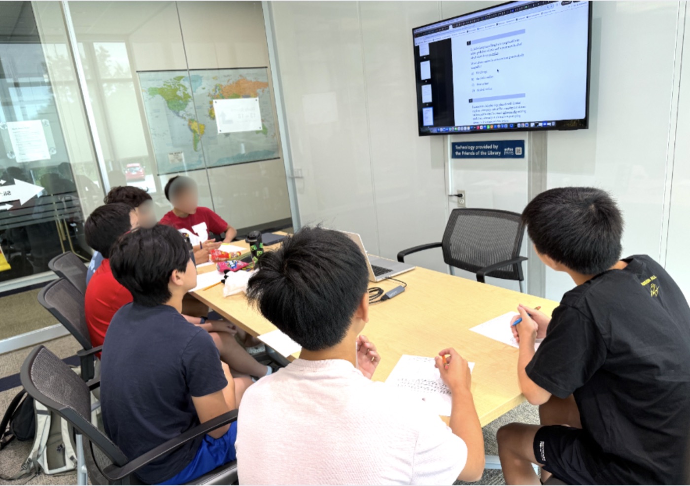 The study group working through PreACT English questions together during Session 2